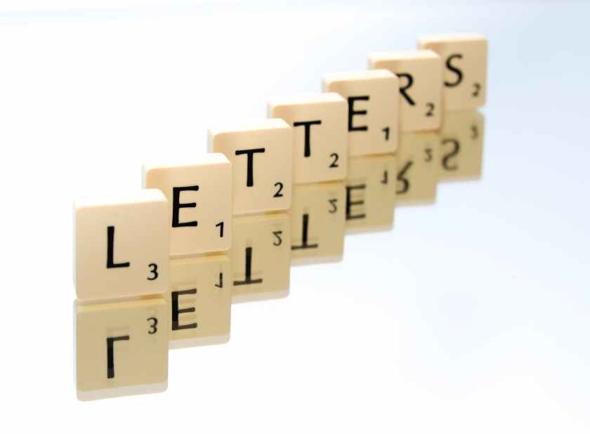 scrabble tiles arranged in letters text