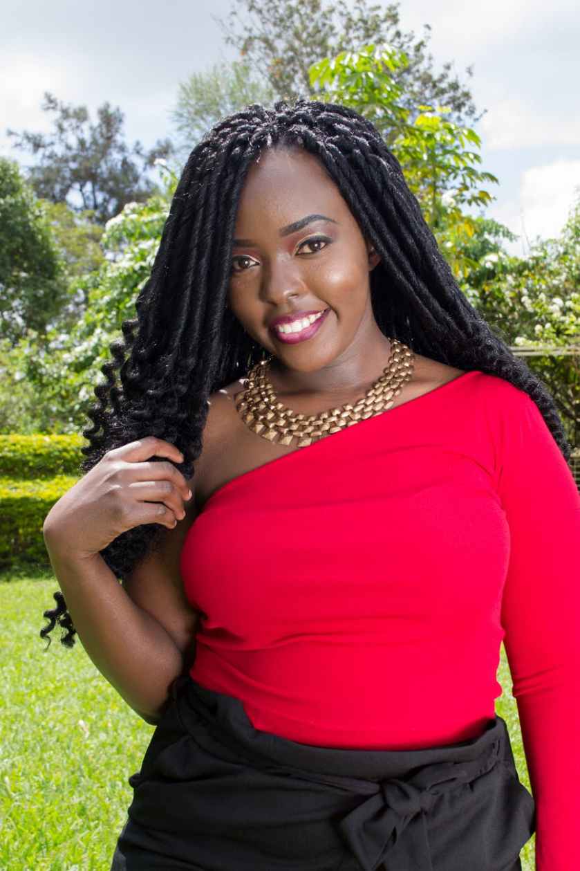 photo of woman wearing red top and black bottoms